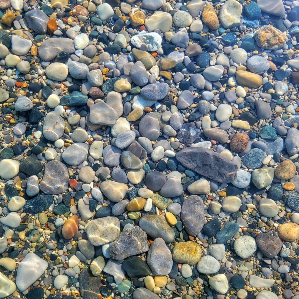 Lake Michigan was exceptionally calm that day.  These colorful rocks were under about ten inches of water.